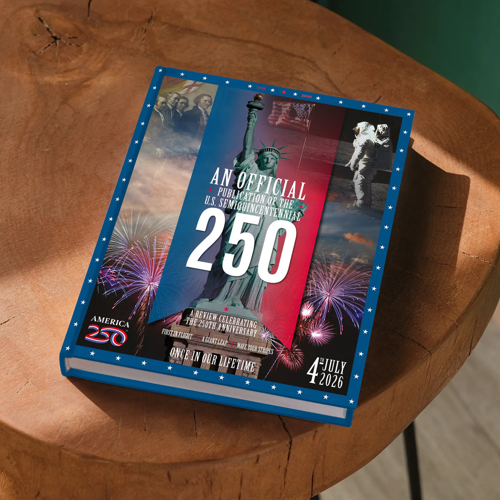 Book with America250 anniversary design on a wooden surface
